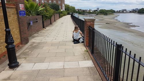 Full length of boy on railing