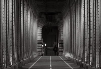 Rear view of man walking in tunnel