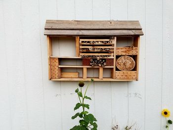 Wooden bee house on wall