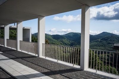 Scenic view of mountains against sky seen through window