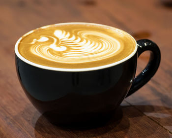 Close-up of cappuccino on table