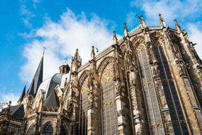 Low angle view of cathedral against cloudy sky