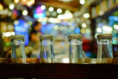 Close-up of wine bottles on table