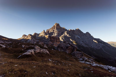 Scenic view of rocky mountains against clear blue sky