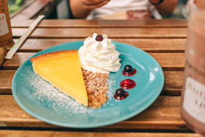 High angle view of cake slice in plate on table