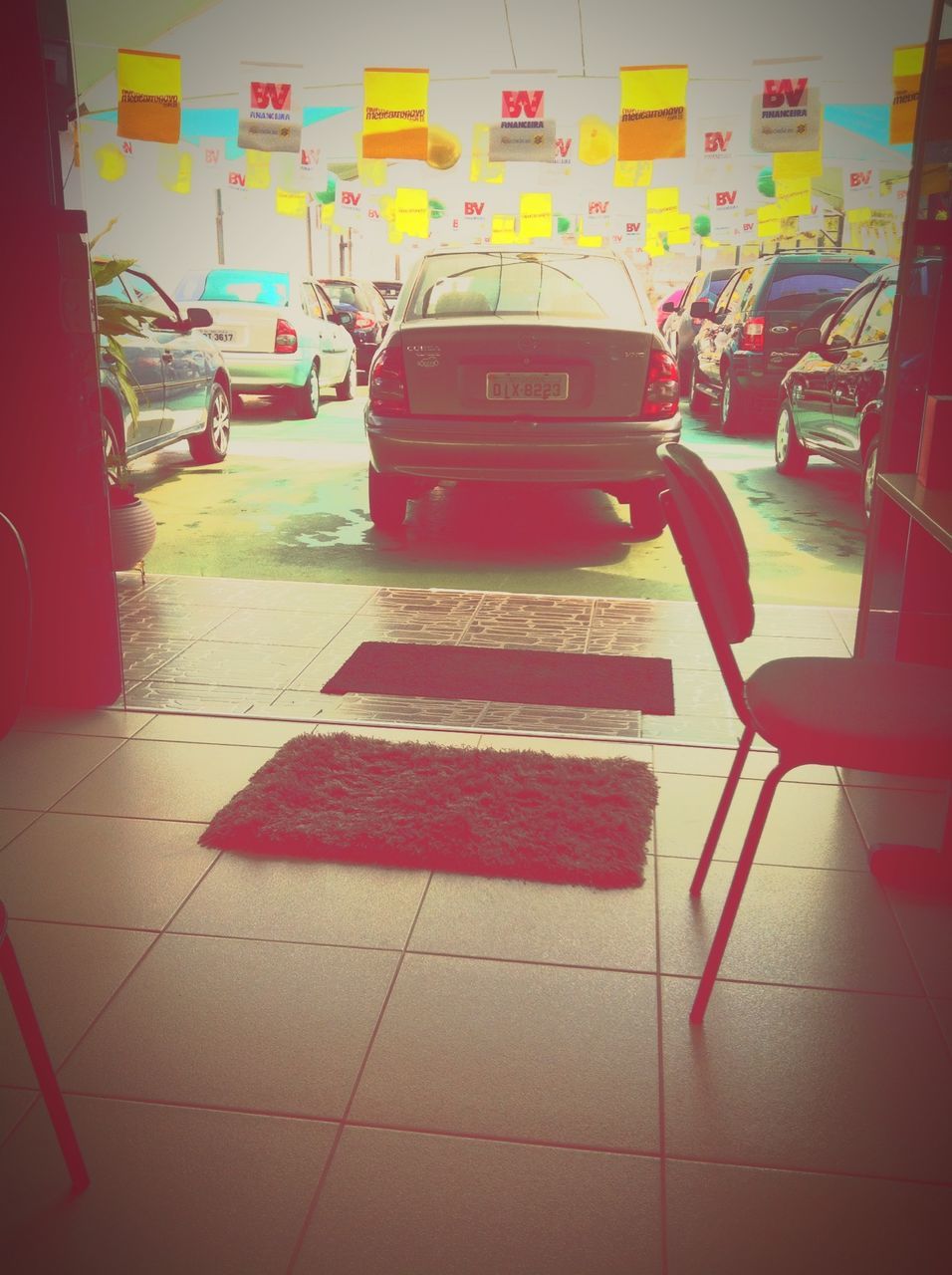 indoors, chair, empty, absence, seat, table, flooring, red, tiled floor, no people, day, multi colored, parking lot, transportation, in a row, high angle view, sunlight, incidental people, sidewalk, floor