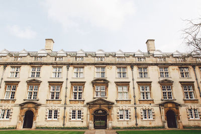 Low angle view of christs college against sky