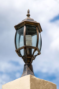 Low angle view of lamp against sky