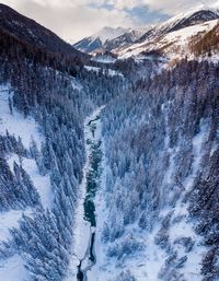 Person walking on snow covered mountain