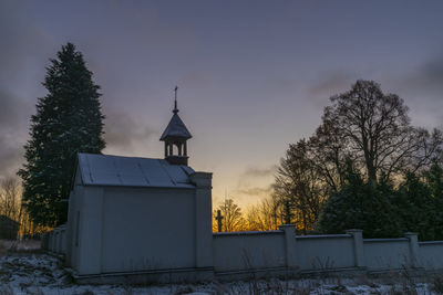 Low angle view of building against sky during sunset