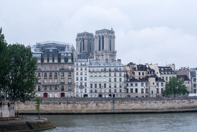 Buildings in city against sky