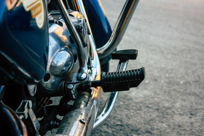 Close-up of motorcycle on road