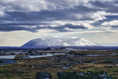 Scenic view of snowcapped mountains against sky