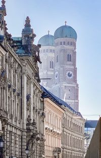 Low angle view of buildings against sky in city