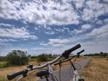 Panoramic view of bicycle on field against sky
