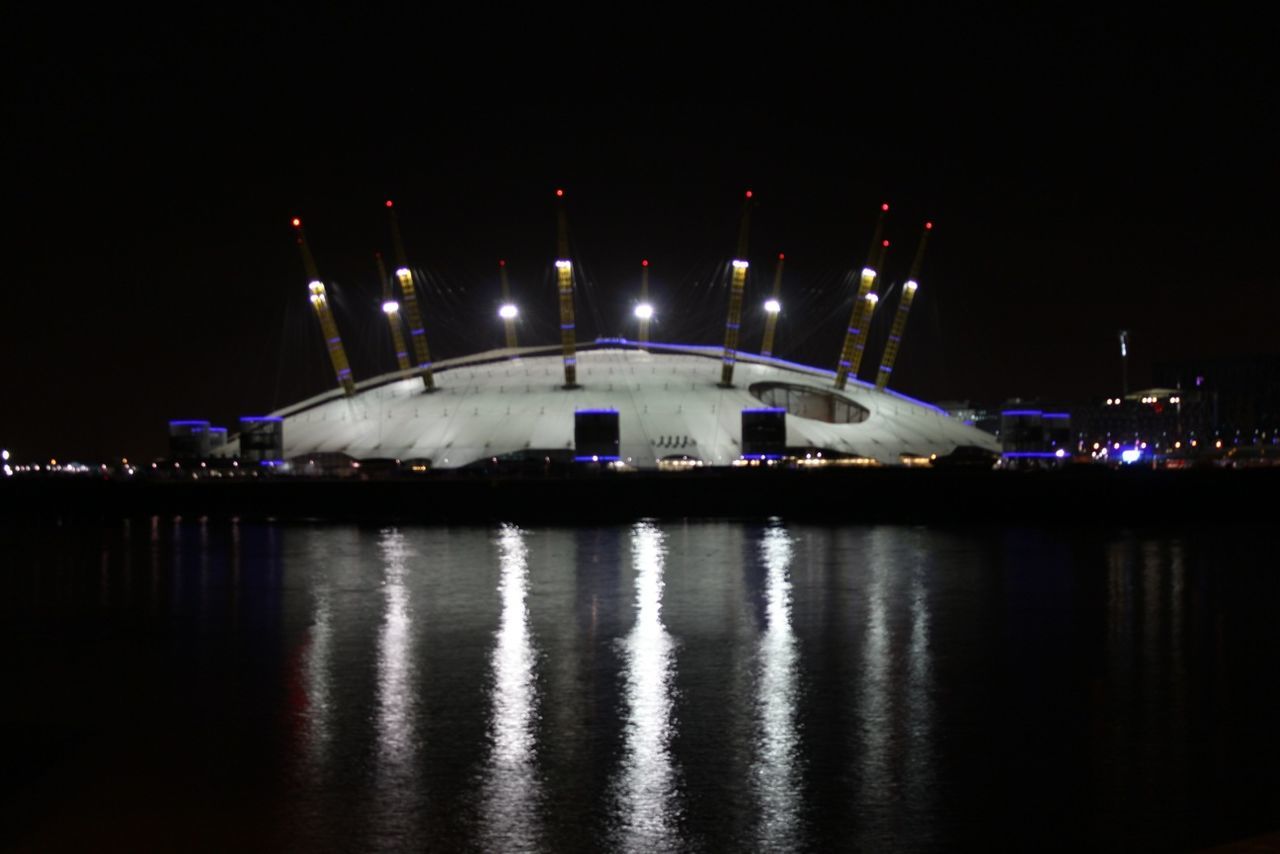 illuminated, night, reflection, waterfront, water, architecture, built structure, river, building exterior, lighting equipment, city, dark, light - natural phenomenon, sky, light, outdoors, no people, glowing, street light, bridge - man made structure