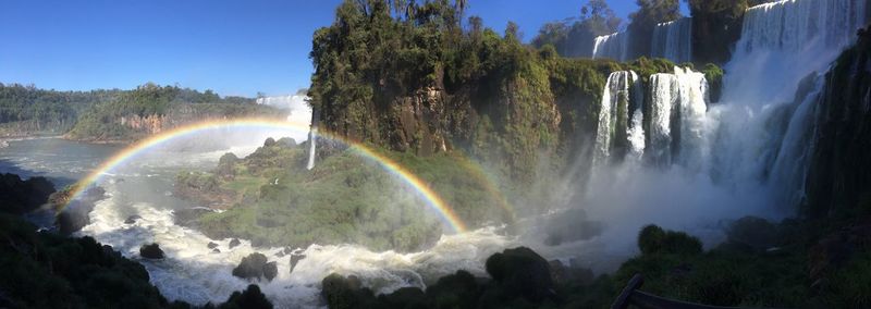 Rainbow against waterfall