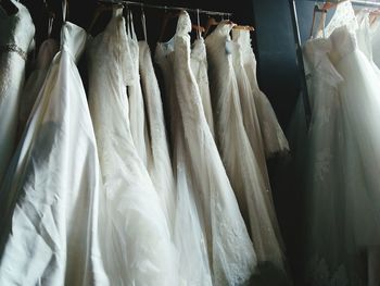 Close-up of clothes hanging in store for sale