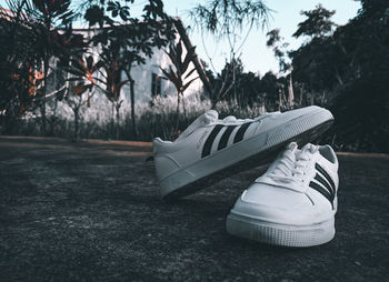 Close-up of shoes on field