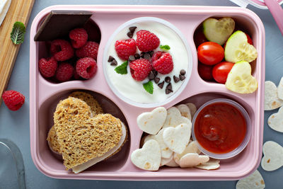 High angle view of strawberries in plate on table