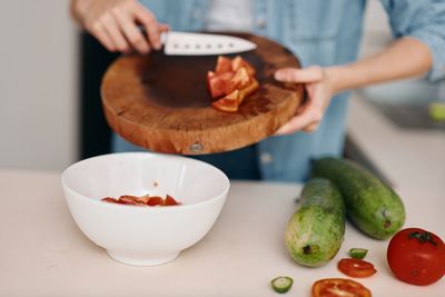 Midsection of man preparing food on table