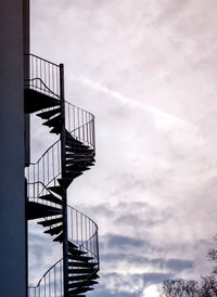 Low angle view of spiral staircase against sky