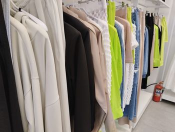 Close-up of clothes hanging in store