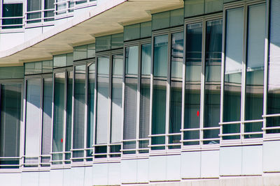 Low angle view of modern glass building in city