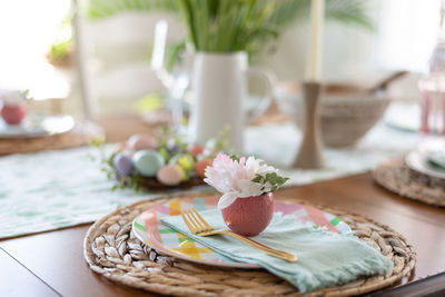 Close-up of roses in basket on table