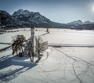 Scenic view of snow covered mountains against sky