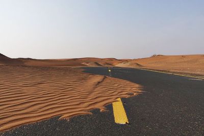 View of country road against clear sky