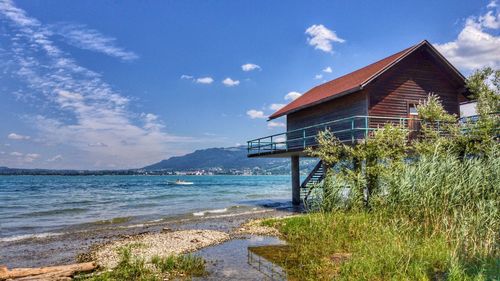 House by sea against sky