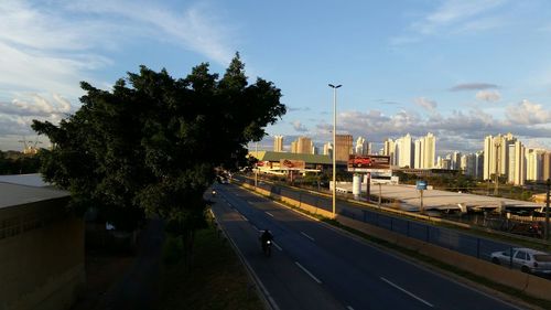 City street against cloudy sky