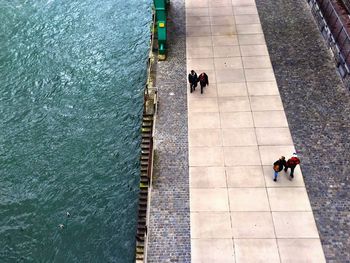 High angle view of people walking on promenade by rhine river