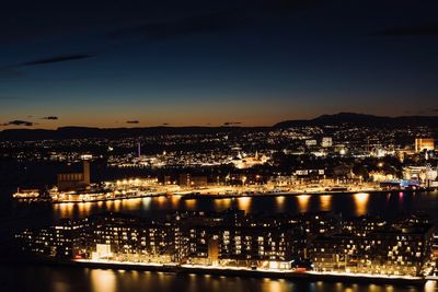 High angle view of illuminated buildings in city at night