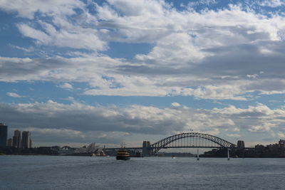 View of bridge over river in city