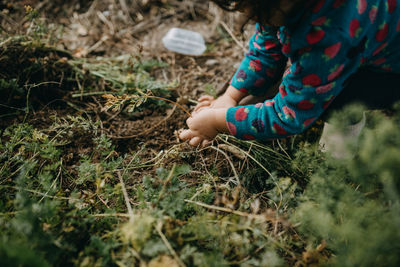 Low section of girl on field