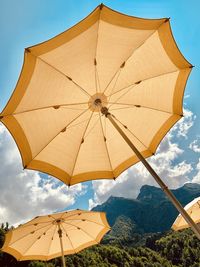 Low angle view of umbrella against sky