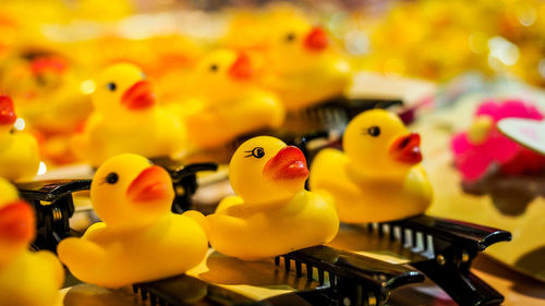 Close-up of yellow toys for sale in market