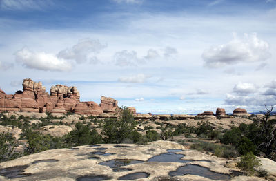 Scenic view of cliff against sky