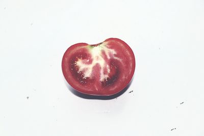 Close-up of strawberry over white background