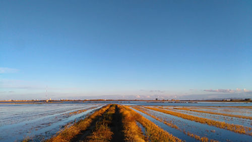 Road against clear sky during winter