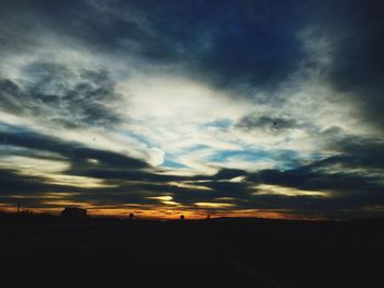 Scenic view of landscape against cloudy sky