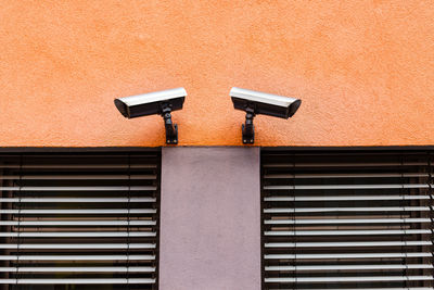 Low angle view of camera on wall