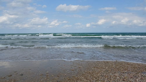 Scenic view of beach against sky