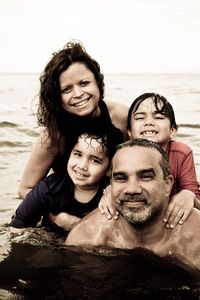 Portrait of smiling family in sea