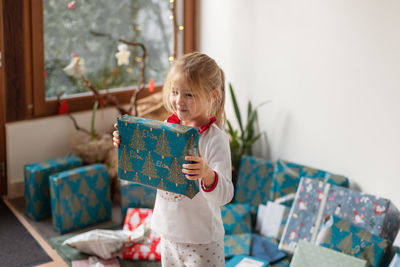 Girl is surprised with a christmas present