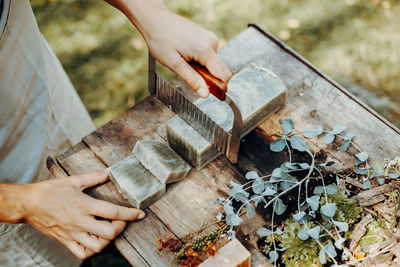 Making handmade natural soaps on an old wooden table