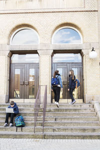 Students on steps of high school