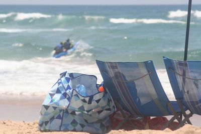 Close-up of flags on beach